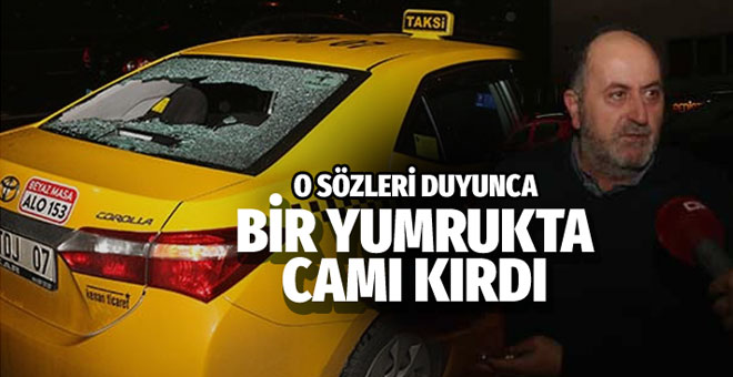 Otopark görevlisi taksinin camını yumruklayarak kırdı